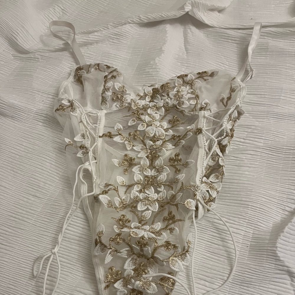 white lace bodysuit with gold floral decal